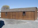 12x32 Gambrel Dutch Barn Style Storage Shed With Coffee Brown LP Smart Side, brown trim, and a shingle roof